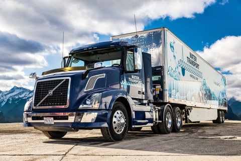 Navy Water Transport tractor-trailer with water graphics on the trailer