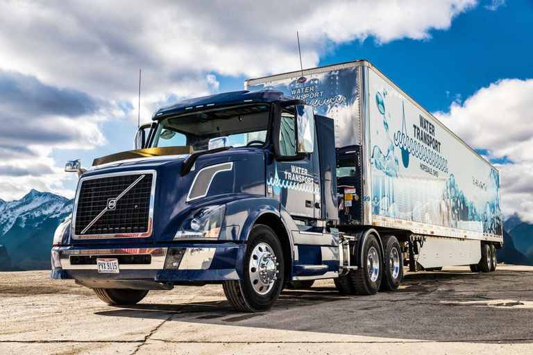 Navy Water Transport tractor-trailer with water graphics on the trailer